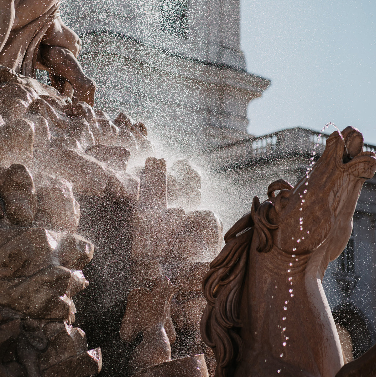 horse sculptured fountain with water misting off the top