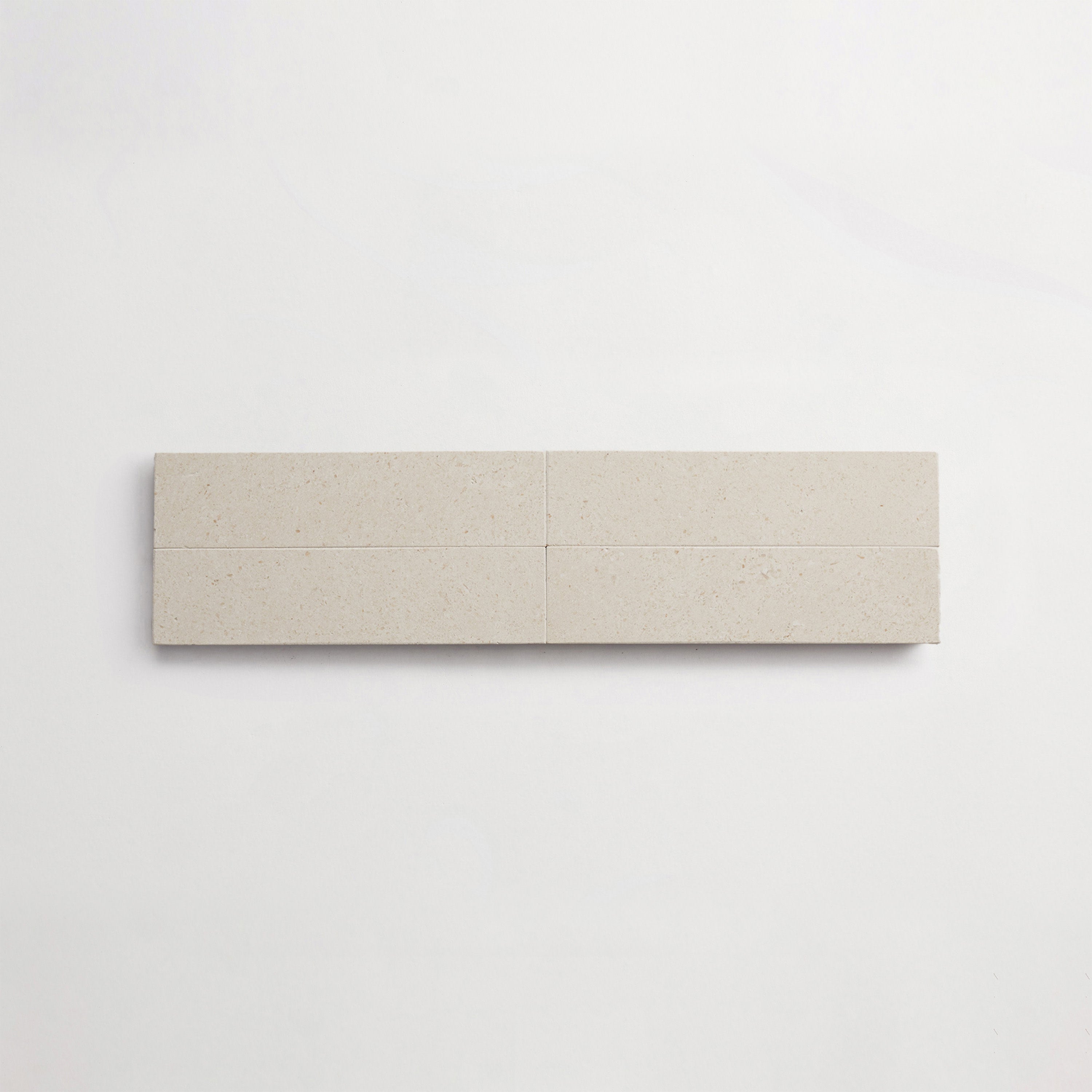 LP0144-cle-terre-lapidary-white-limestone-2x8-cigar-4up-3000x3000.jpg