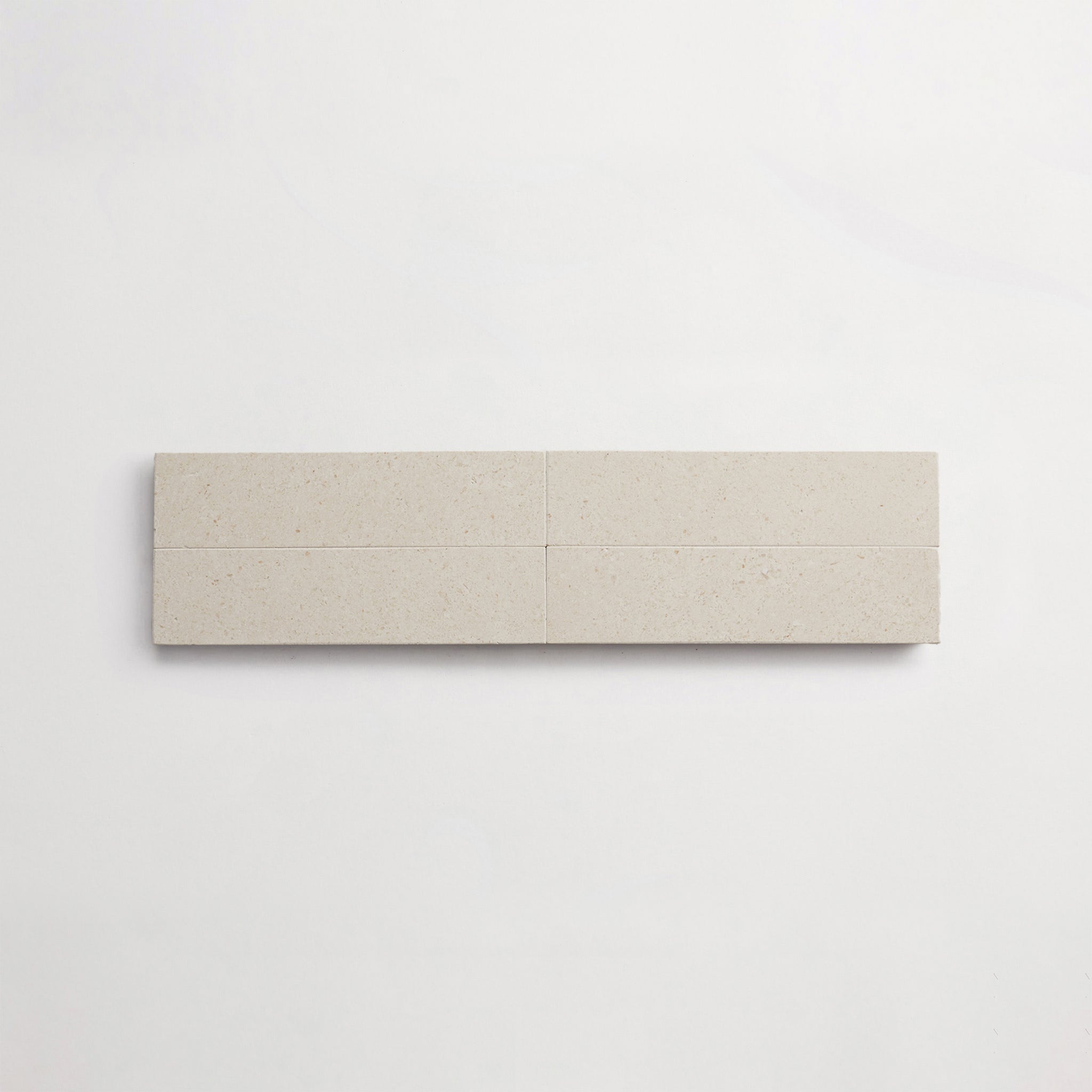 LP0144-cle-terre-lapidary-white-limestone-2x8-cigar-4up-3000x3000.jpg